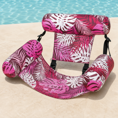 Poolora Float Chair in Coral Pink tropical leaf print beside a swimming pool